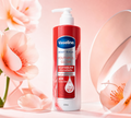 Thai Ranee Vaseline Youthful Glow GlutaGlow body wash in a red and white pump bottle with floral background.