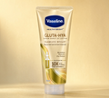 Thai Ranee Vaseline Healthy Bright Gluta-Hya Serum Burst UV Lotion Flawless Bright 330ml tube in gold packaging.