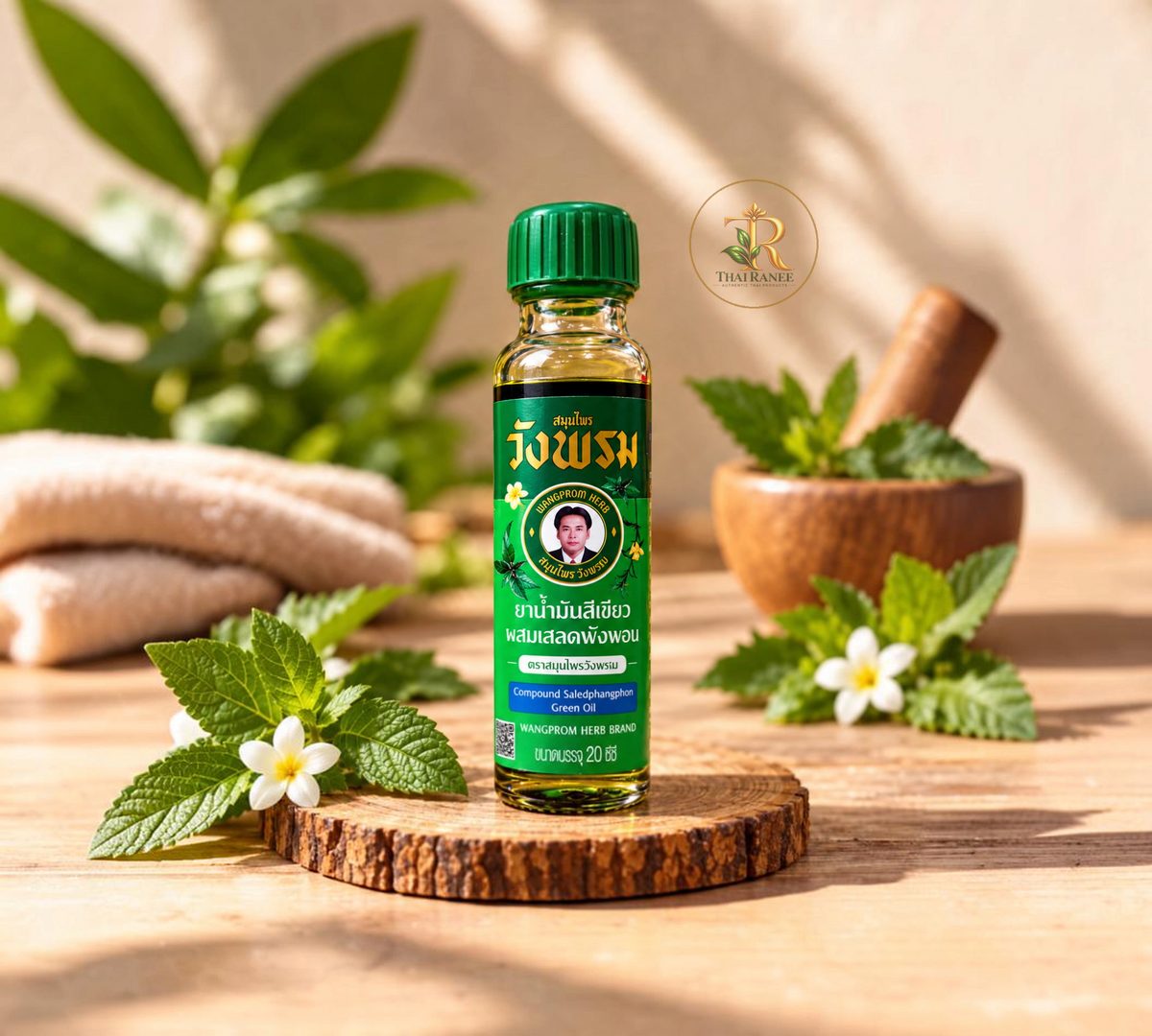 Thai Ranee Wangprom Herb Compound Saledphangphon green oil in a 20cc bottle for insect bite relief.