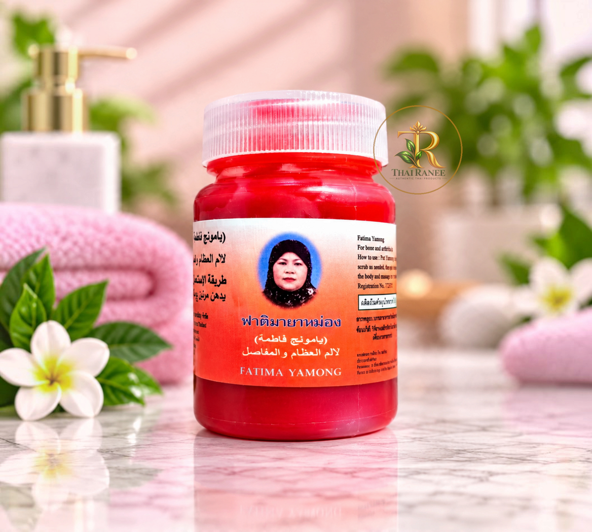 Thai Ranee Fatima Brand Balm with clove oil in a red jar for soothing body discomfort and insect bites