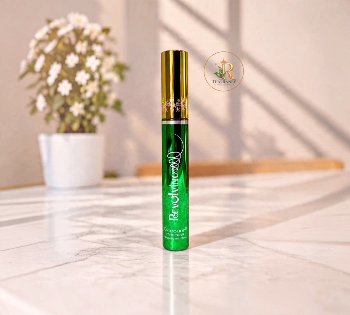 Thai Ranee BQ Cover Revolving Mascara in a green tube with a gold cap for long-lasting, voluminous curled lashes.