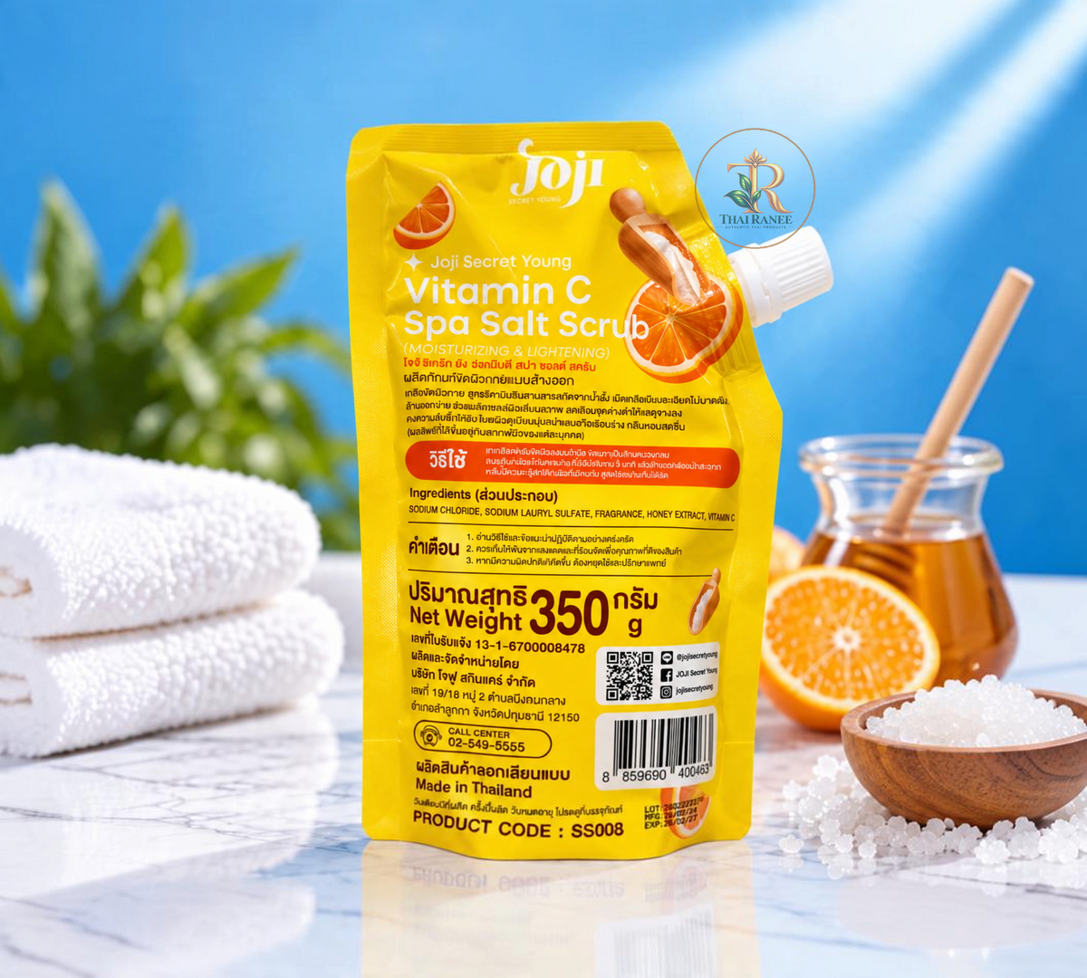 Thai Ranee Joji Secret Young Vitamin C Spa Salt Scrub in a yellow pouch with honey and orange illustrations