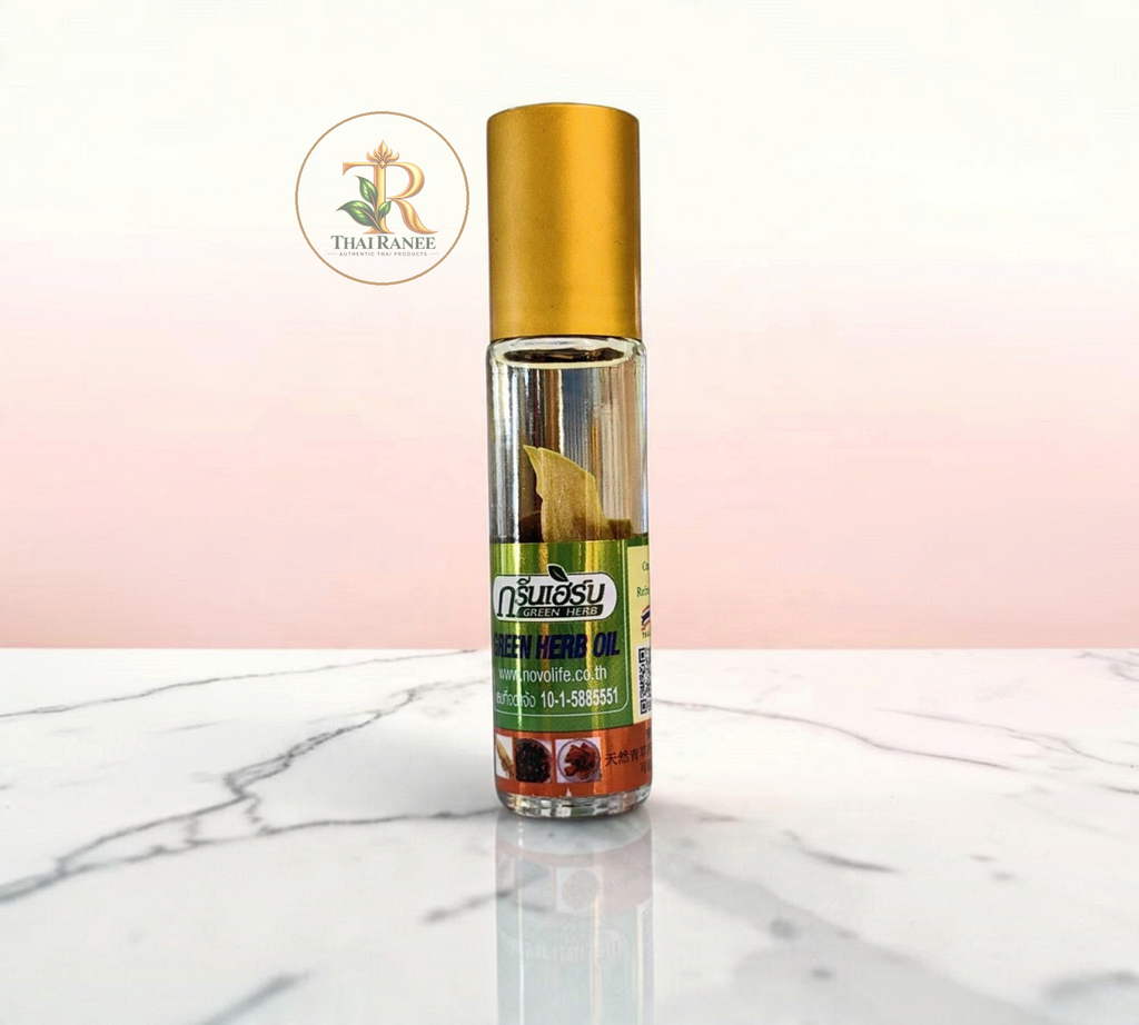 Thai Ranee Green Herb Ginseng Root aroma oil in a compact 8cc roll-on bottle with a gold cap on a marble surface.