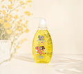 Thai Ranee Babi Mild Happy Sunshine organic head and body baby bath in a yellow pump bottle with floral design
