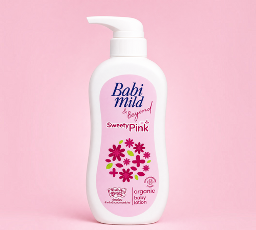 Thai Ranee Babi Mild & Beyond Sweety Pink organic baby lotion in a 350ml pump bottle against a soft pink background.