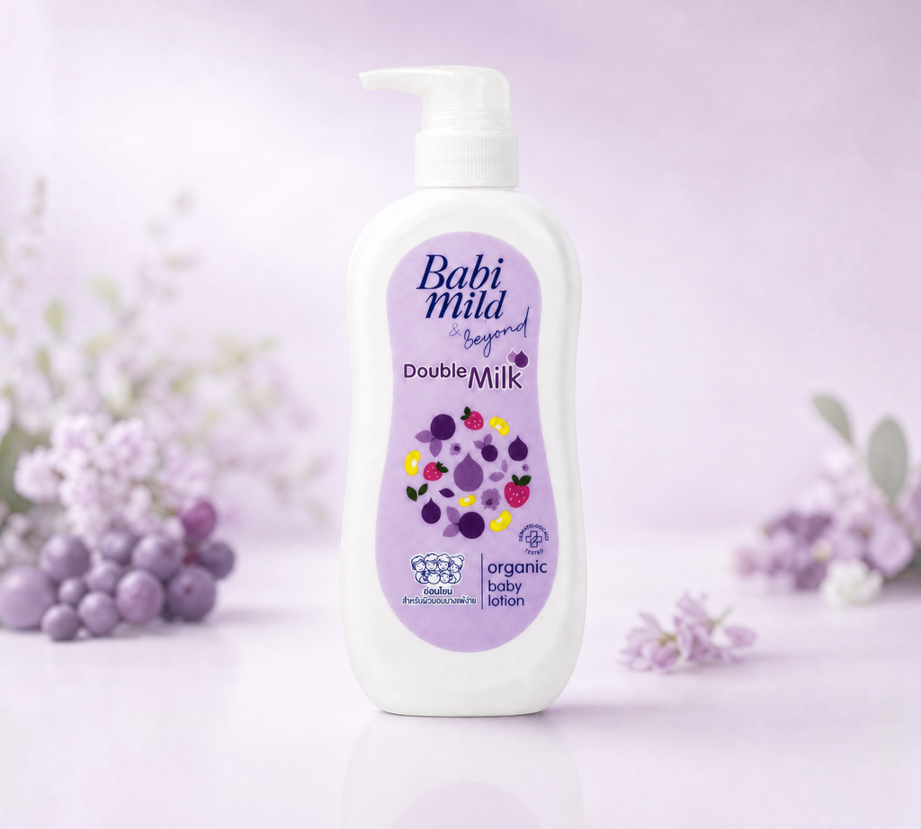 Thai Ranee Babi Mild & Beyond Double Milk organic baby lotion in a 350ml pump bottle on a soft purple background.