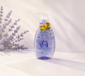 Thai Ranee Babi Mild organic lavender head and body baby bath in a clear pump bottle on a soft purple background.