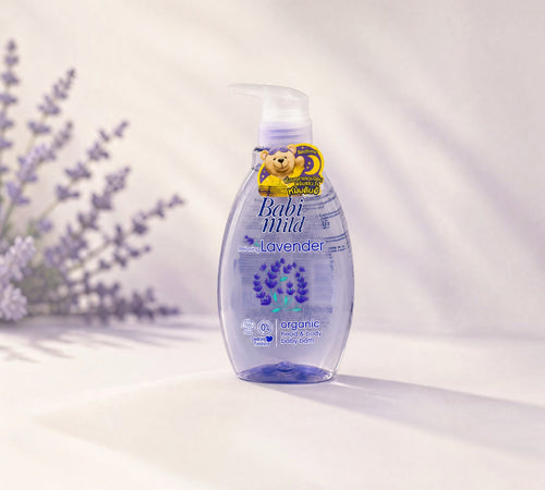 Thai Ranee Babi Mild organic lavender head and body baby bath in a clear pump bottle on a soft purple background.