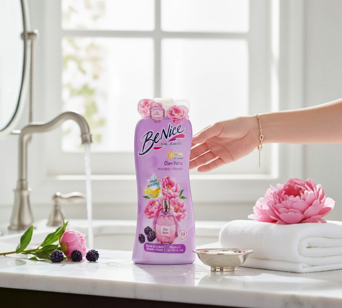 Thai Ranee BeNice Glam Paris Bloom In A Bath shower cream bottle on a marble bathroom counter with fresh peonies.