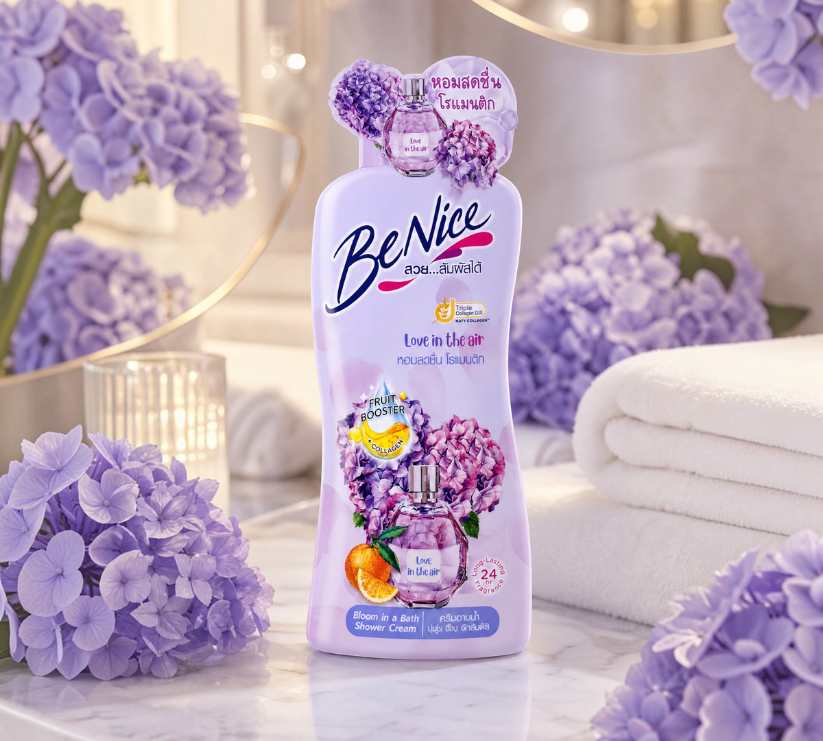 Thai Ranee BeNice Love In The Air Bloom shower cream bottle with floral hydrangea and orange accents on a marble tray