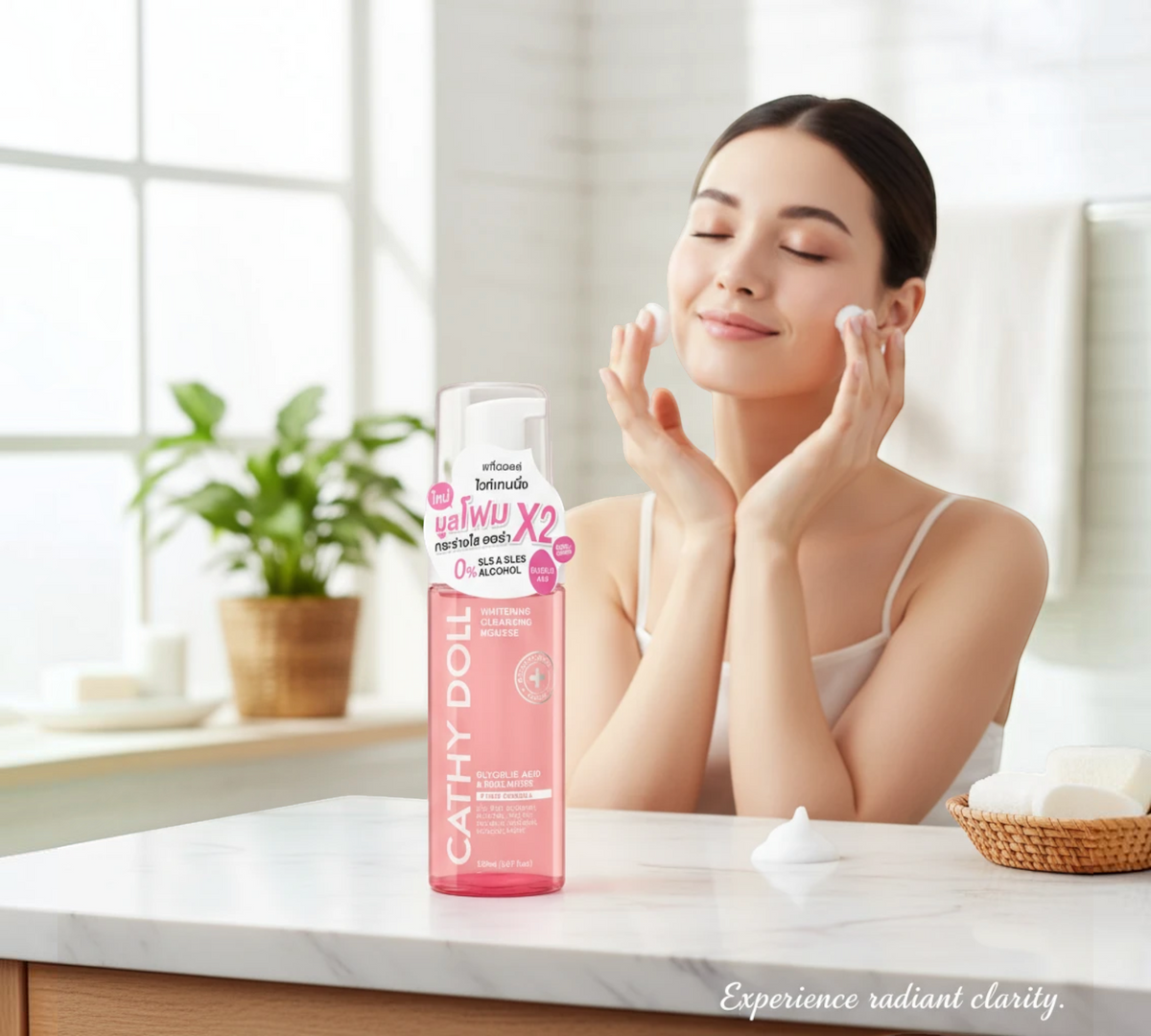 Thai Ranee Cathy Doll whitening cleansing mousse bottle with glycolic acid next to a woman applying foam to her face