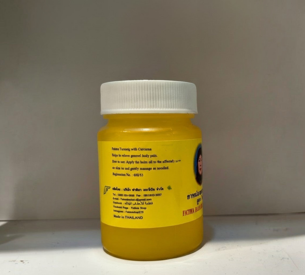 Thai Ranee Fatima Balm Phlai Formula herbal relief balm in a golden jar for soothing muscle aches and tension.