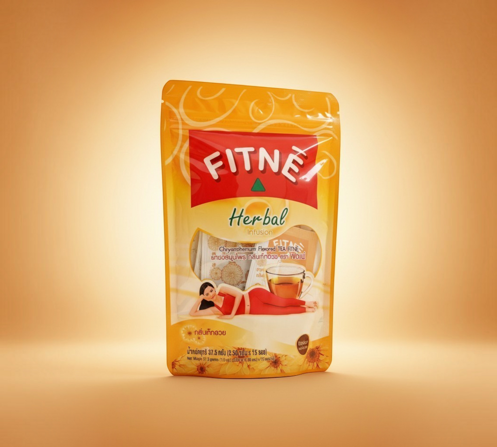 Thai Ranee FITNÈ chrysanthemum herbal tea bag pouch with a warm golden design and a woman relaxing in the foreground