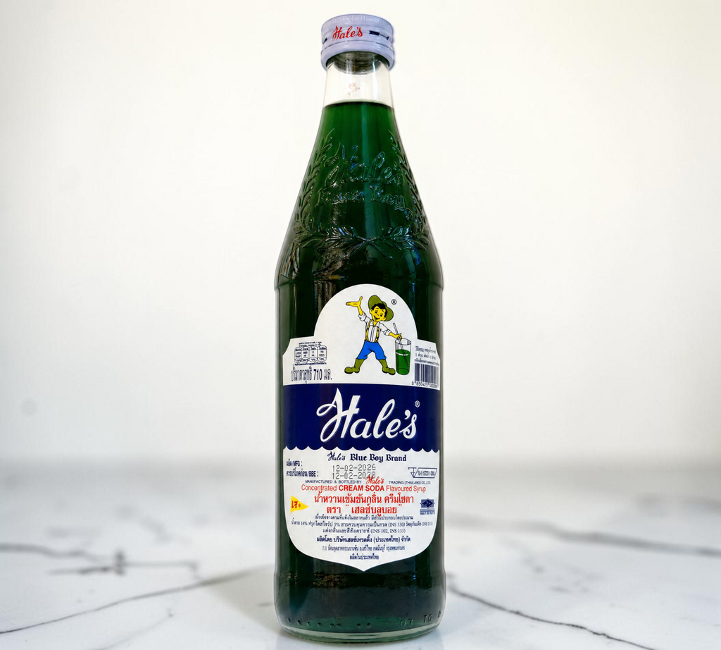 Thai Ranee Hale's Blue Boy concentrated cream soda syrup in a 710ml glass bottle with a vibrant emerald-green liquid.