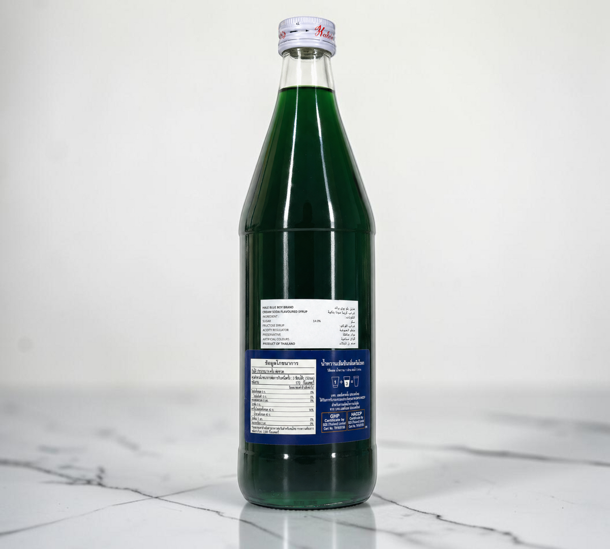 Thai Ranee Hale's Blue Boy concentrated emerald-green cream soda flavoured syrup in a 710ml glass bottle