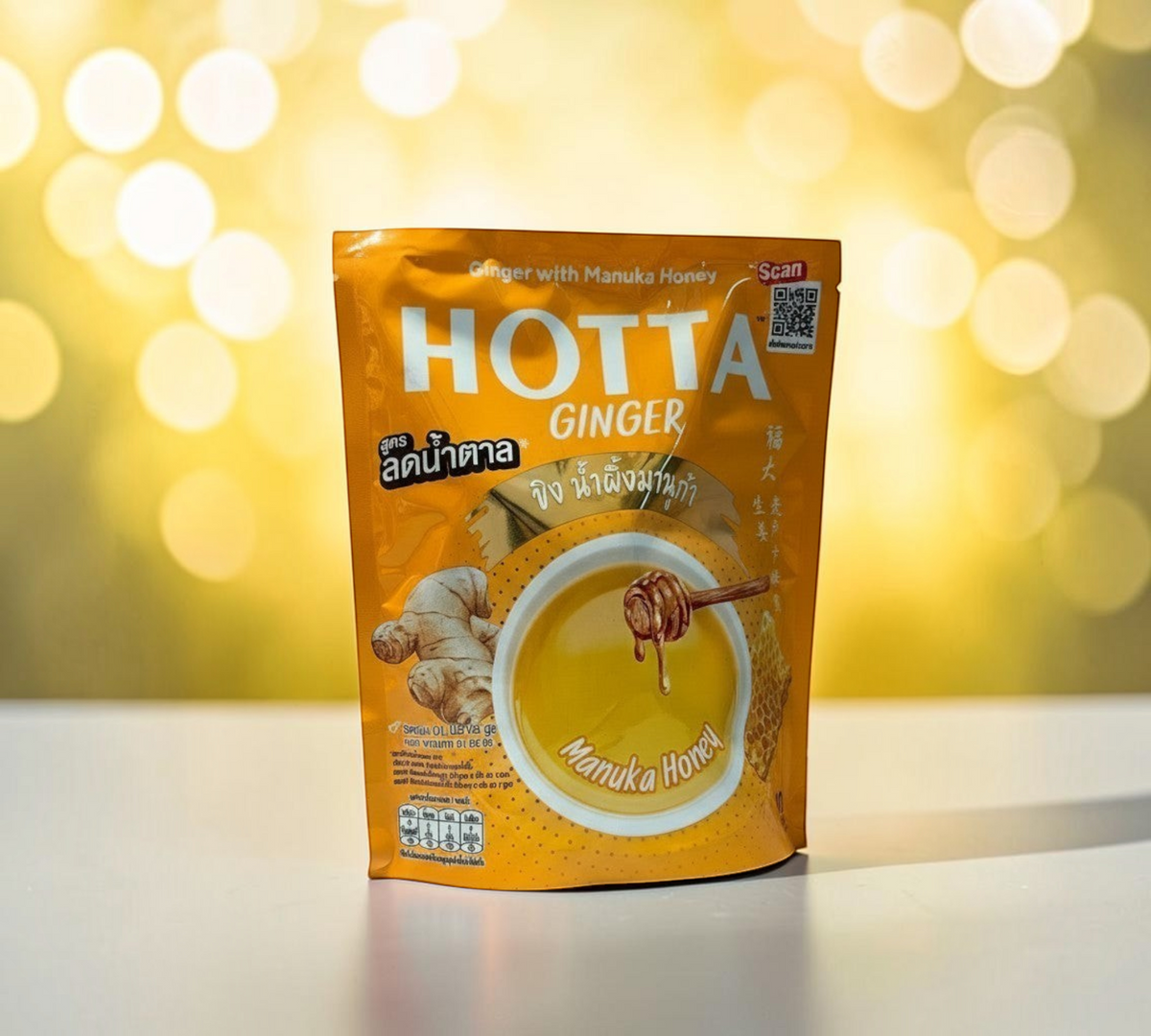 Thai Ranee HOTTA instant ginger beverage with Manuka honey in a golden yellow pouch with a ginger root illustration.