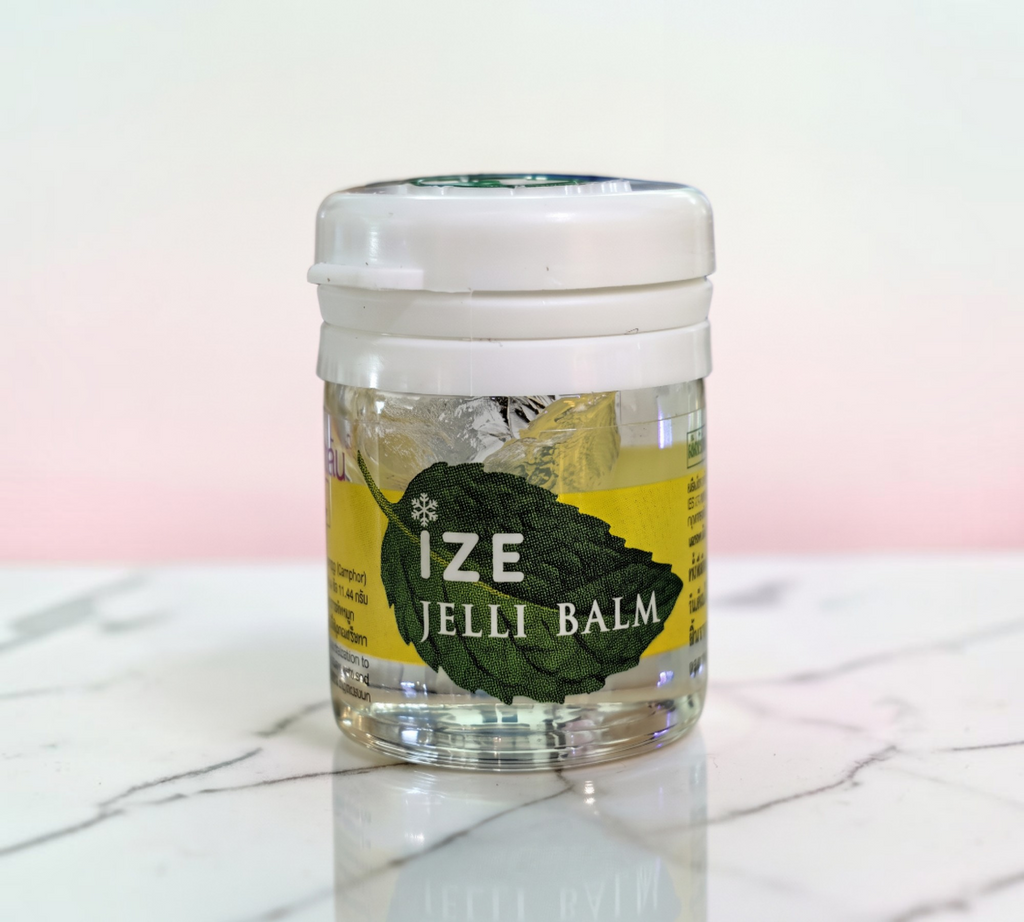 Thai Ranee Ize Jelli Balm cooling relief gel in a clear jar with a white lid, featuring a green leaf graphic.