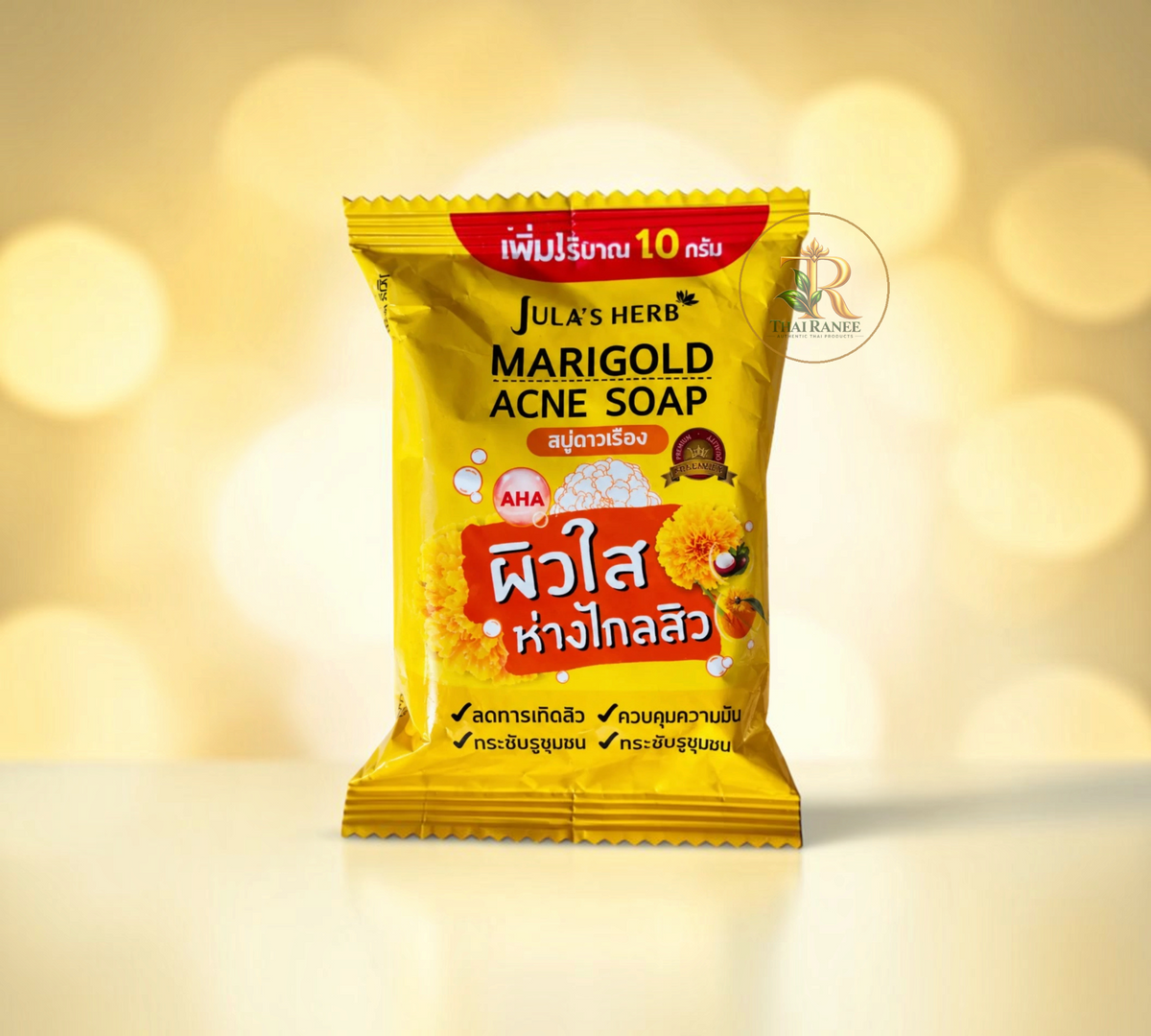 Thai Ranee Jula's Herb Marigold Acne Soap cleansing bar in a bright yellow packet with marigold flower illustrations.