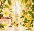 Thai Ranee Oriental Princess Frangipani Bouquet hair cologne spray bottle surrounded by tropical flowers and foliage.