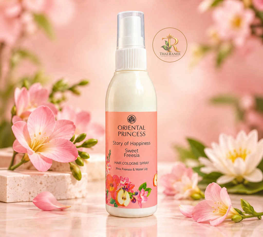 Thai Ranee Oriental Princess Sweet Freesia hair cologne spray bottle surrounded by pink flowers and water lilies.