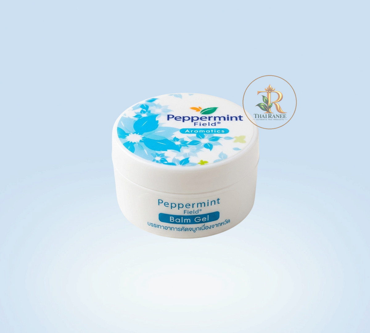 Thai Ranee Peppermint Field Balm Gel in a small white 8g container with blue floral branding for nasal relief.