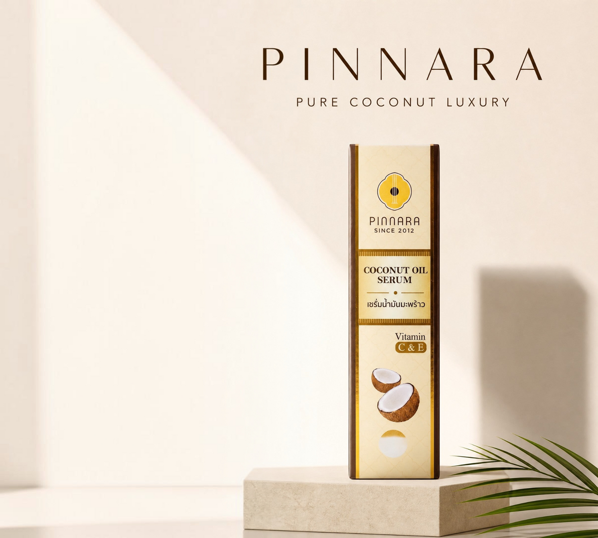 Thai Ranee Pinnara coconut oil serum bottle with vitamin C and E for hair and skin nourishment on a display stand.
