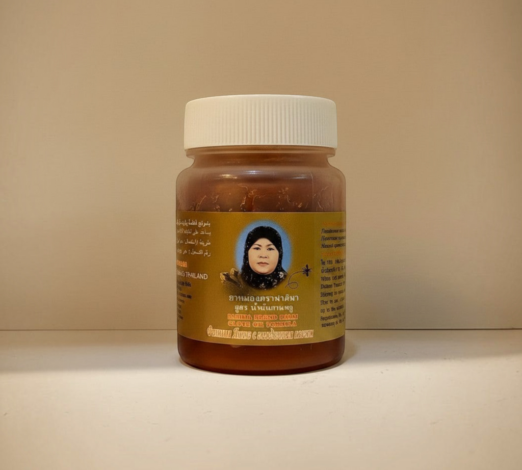 Thai Ranee Rahima Brand herbal balm in a compact jar with clove oil formula for muscle and joint pain relief
