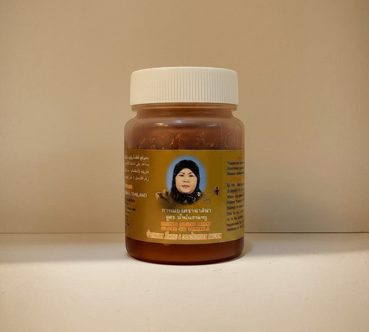 Thai Ranee Rahima Brand herbal balm in a compact jar with clove oil formula for muscle and joint pain relief