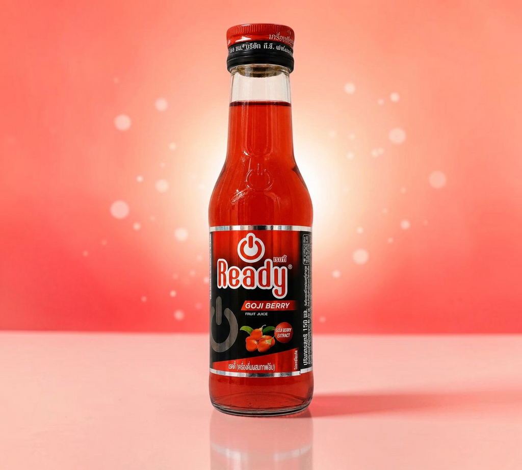 Thai Ranee Ready Goji Berry fruit juice energy drink in a 150ml glass bottle against a vibrant red background.