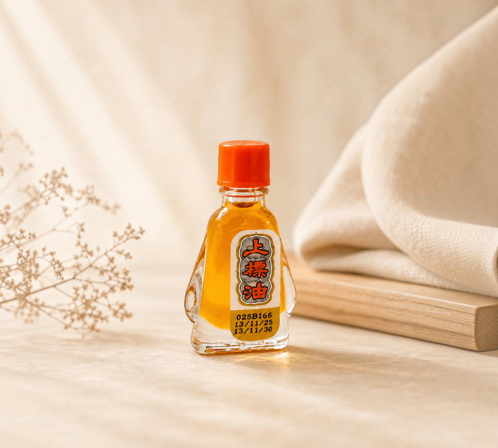 Thai Ranee Siang Pure Oil Formula I herbal oil in a small glass bottle with an orange cap on a neutral background.
