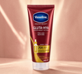 Thai Ranee Vaseline Healthy Bright Gluta-Hya Serum Burst Lotion Pro-Age Restore in a 290ml maroon squeeze tube.