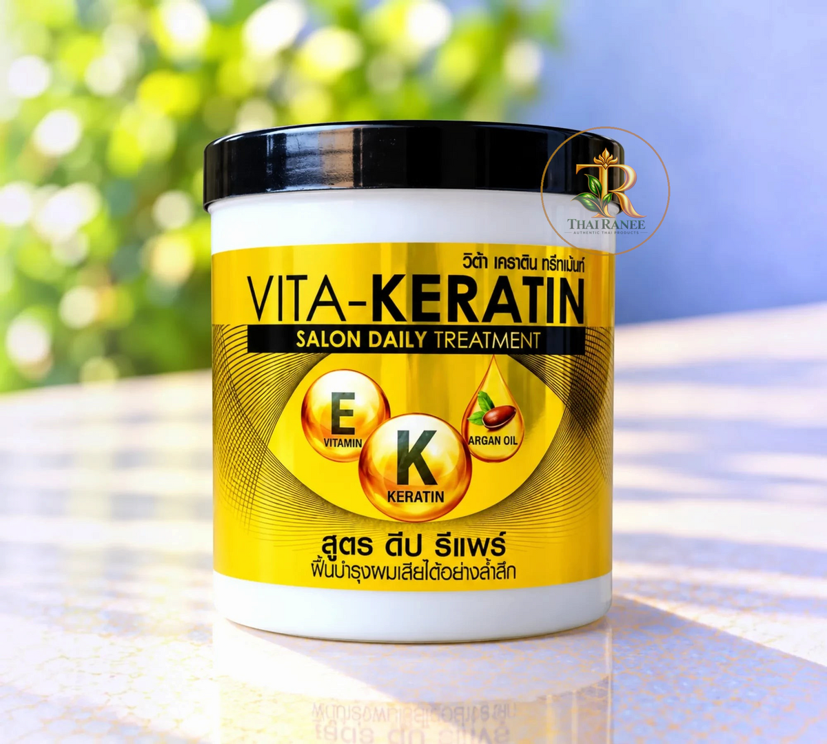 Thai Ranee Vita-Keratin Salon Daily Treatment hair repair mask in a yellow and white jar with Vitamin E and Argan Oil.